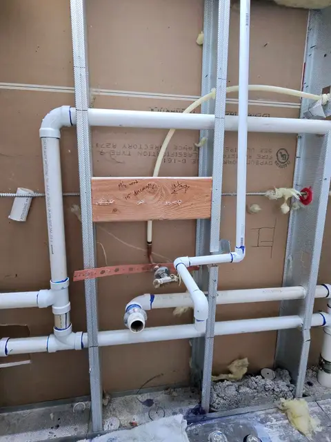 Bathroom rough-in with new PVC drains and PEX supply lines