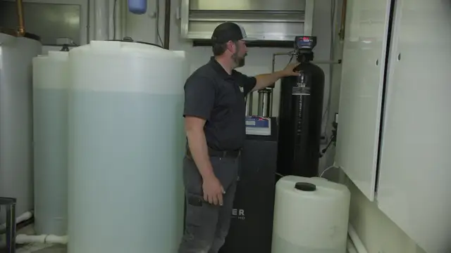 Element technician checking a commercial water treatment system
