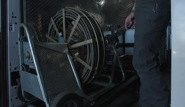 Drain cleaning cable machine loaded in the service van