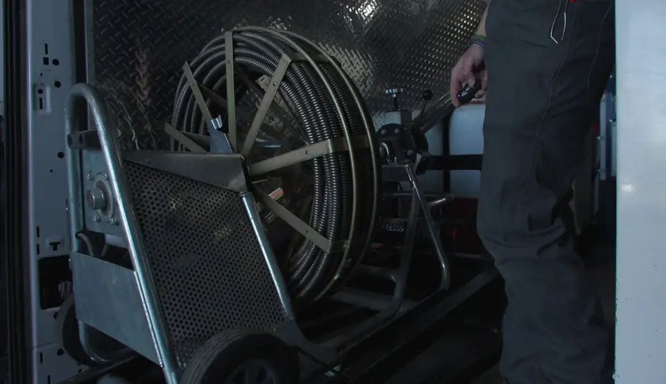 Drain cleaning cable machine loaded in the service van
