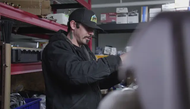 Element plumber preparing parts in the shop