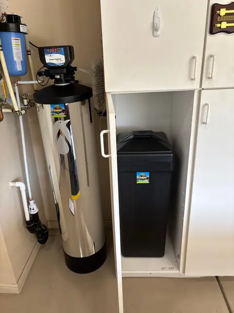 Water softener, sediment filter and brine tank installed in a utility closet