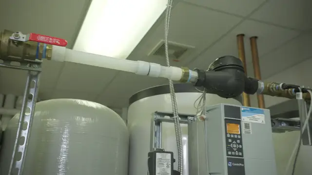 Water treatment tanks with piping and flow control valves