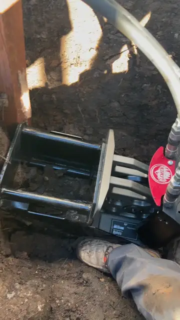 Pipe-bursting rig set up for a trenchless sewer replacement
