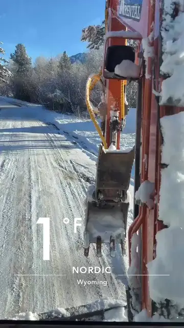 Excavator digging on a 1°F winter emergency in Wyoming